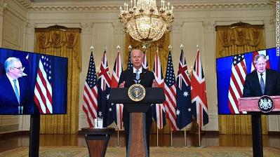 US President Joe Biden speaks on national security with British Prime Minister Boris Johnson, right, and Australian Prime Minister Scott Morrison, left, in East Room of the White House in Washington, DC, on September 15.